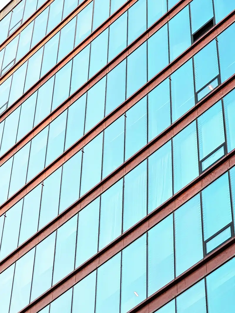 Repeating structural lines on a modern office facade